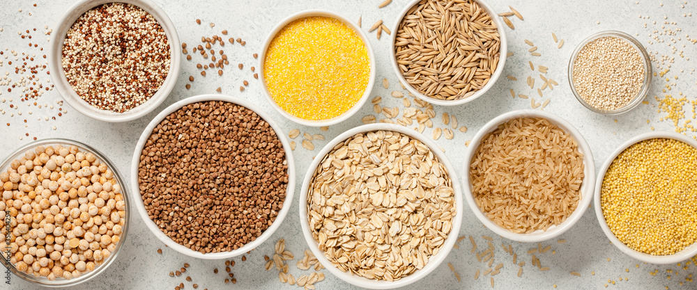Set with various cereal grains on stone background Set with various cereal grains on stone background
