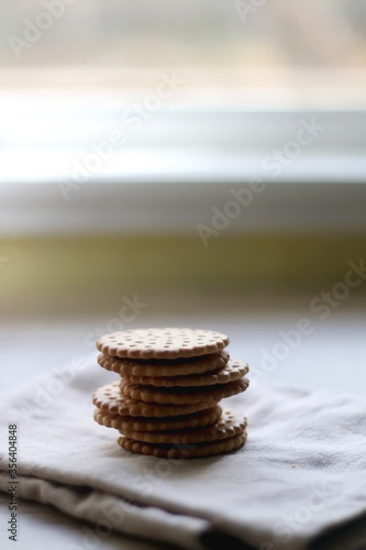 Stack of cookies with chocolate filling. Selective focus.