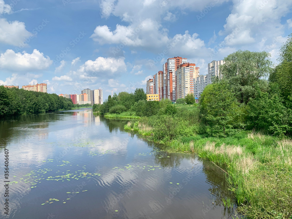 Moscow region, the city of Balashikha. Pekhorka river in summer morning and  view of Zarechnaya street