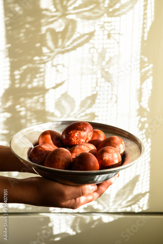 Red easter eggs on a plate.