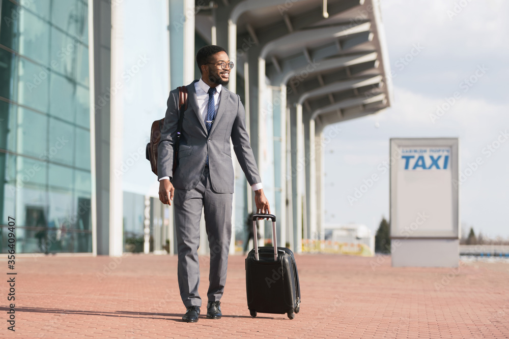 Happy African Businessman Arriving In Airport Walking With Suitcase Outdoor Happy African Businessman Arriving In Airport Walking With Suitcase Outdoor