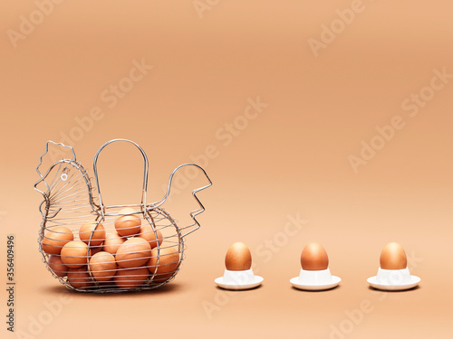 hen-shaped egg cup and three eggs behind