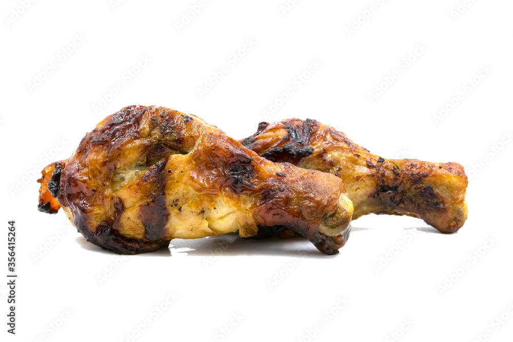 Grilled barbecue chicken drumstick isolated on white background Grilled barbecue chicken drumstick isolated on white background