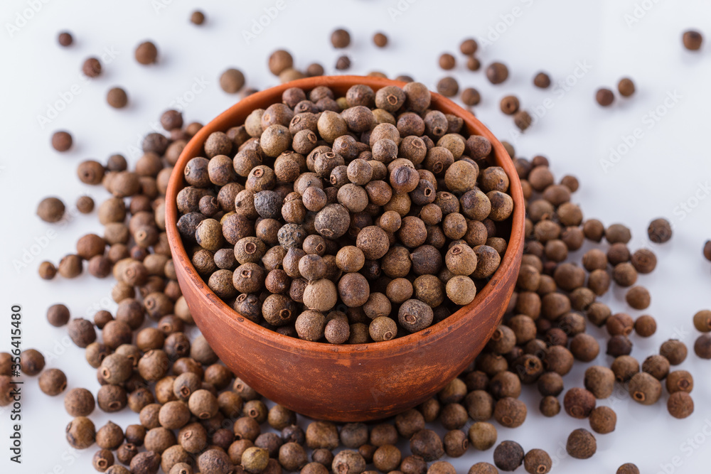 fresh spicy peppers allspice on white acrylic background fresh spicy peppers allspice on white acrylic background
