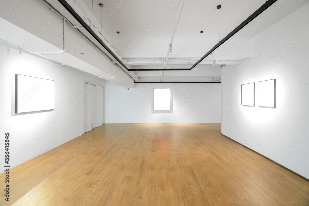 White walls and grey cement floors in the interior space White walls and grey cement floors in the interior space
