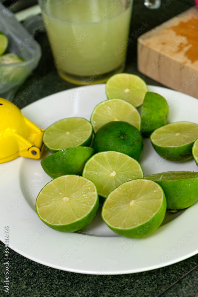 Half cut lemon on the white dish Half cut lemon on the white dish