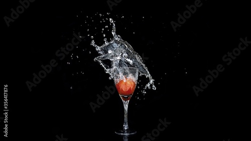 beautiful splash of liquid into wine glass