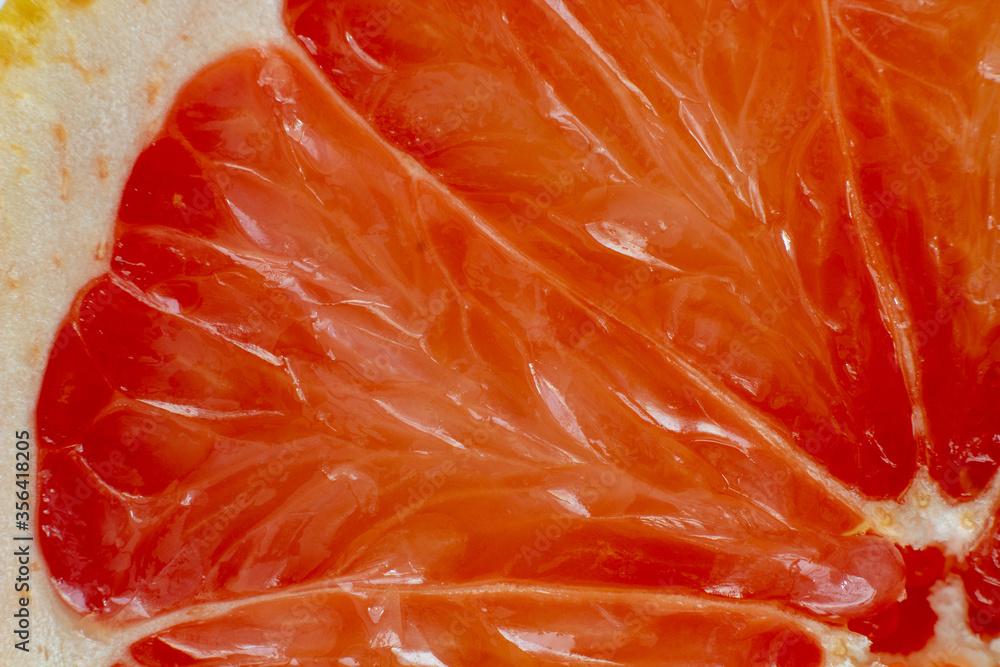 Sliced red grapefruit texture macro close up background Sliced red grapefruit texture macro close up background