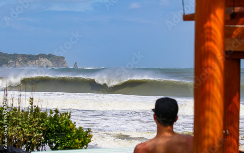 surfing a wave in Japan , lareg waves created by Tyhoon swell in Asia. photo