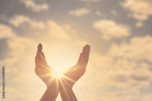 Woman hands, sun and sky with copyspace showing freedom or solar power concept