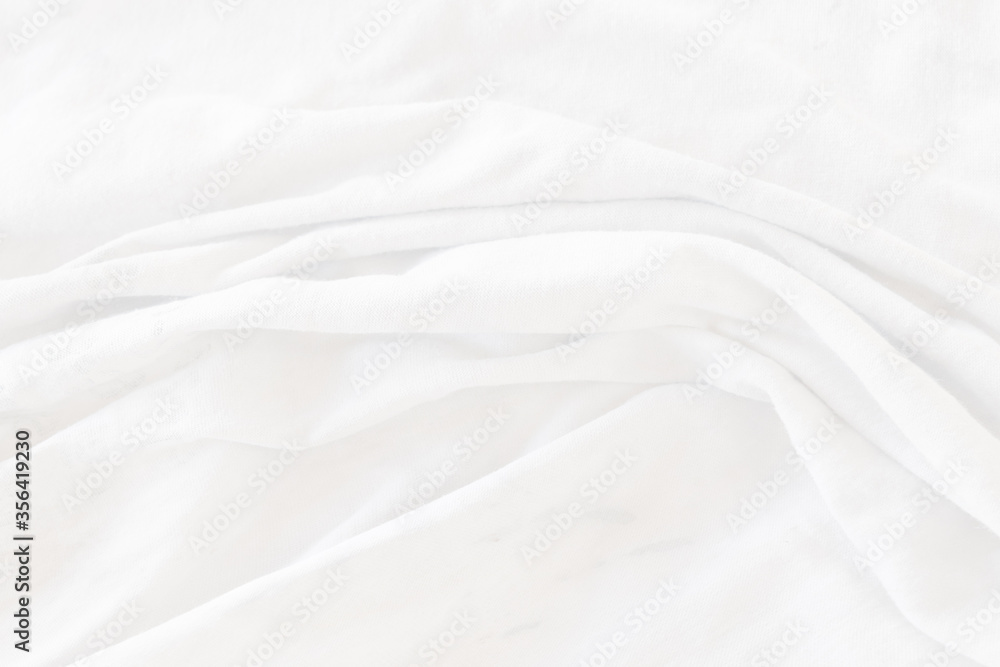 Top view Abstract White cloth background with soft waves.Wave and curve overlapping with different shadow of color,white fabric, crumpled fabric. Top view Abstract White cloth background with soft waves.Wave and curve overlapping with different shadow of color,white fabric, crumpled fabric.