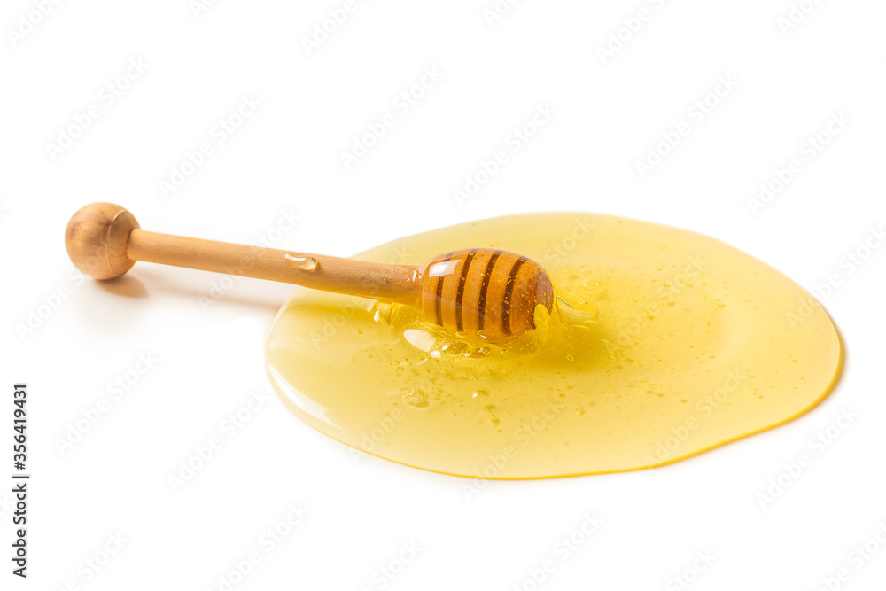 Dipper with honey on a white background. Dipper with honey on a white background.