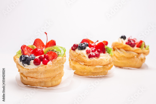 Home made cake with cream and fruits isolated.
