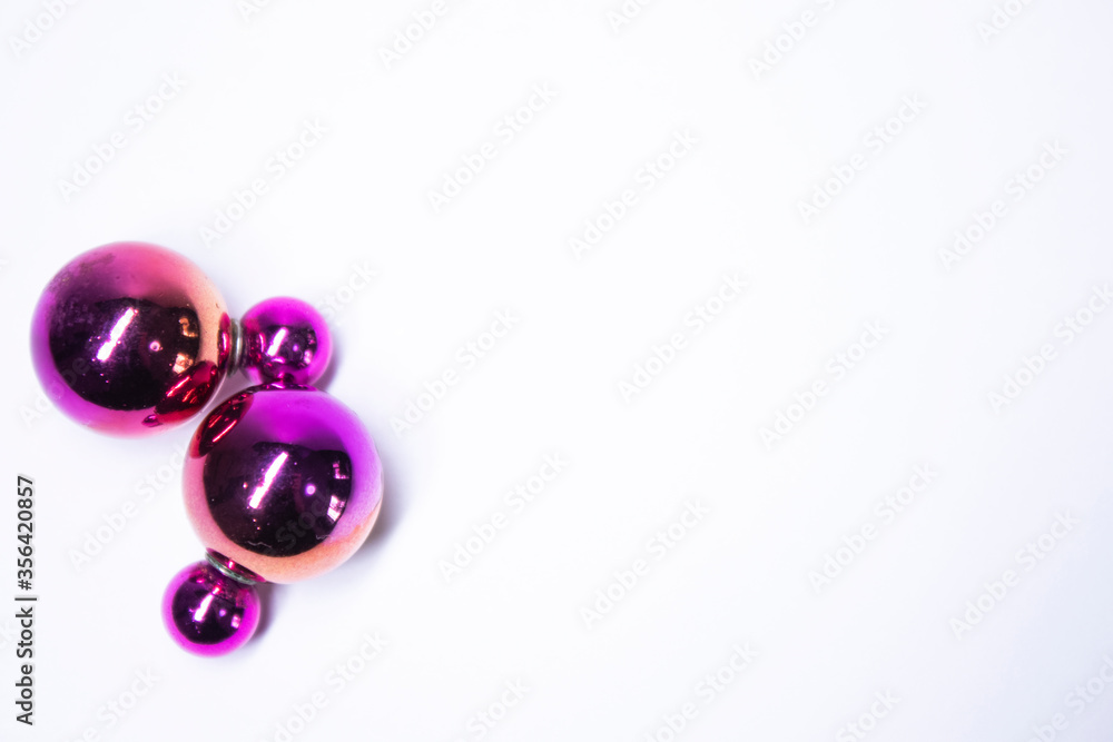 Pink round earrings. jewelry and accessories concept. Isolated, copy space. Macro Shot. High quality photo Pink round earrings. jewelry and accessories concept. Isolated, copy space. Macro Shot. High quality photo