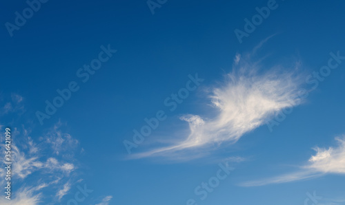 Dramatic sky with white clouds.