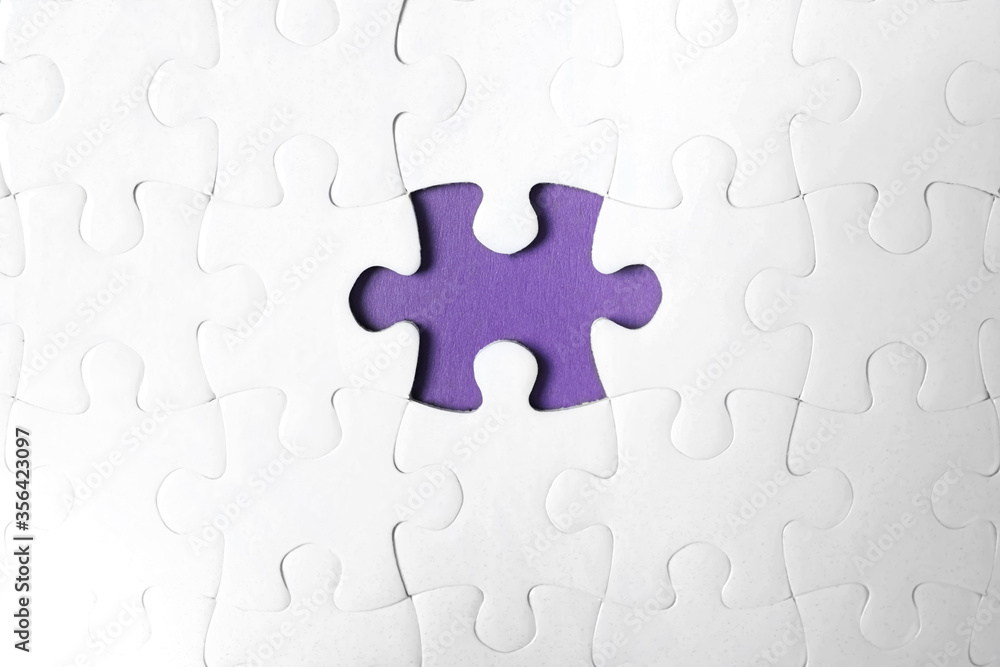 Blank white puzzle with missing piece on purple background, top view Blank white puzzle with missing piece on purple background, top view