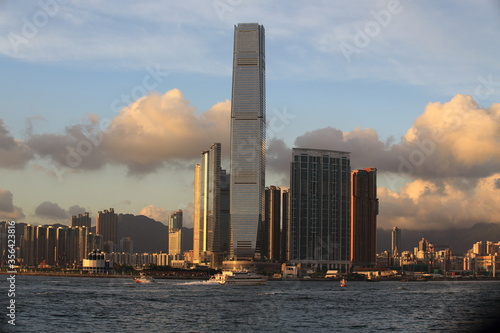 wonderful city landscape of victoria harbour in hong kong with glows , international commerce centre