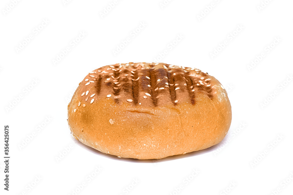 Delicious and fresh bun sprinkled with seeds on white background Delicious and fresh bun sprinkled with seeds on white background