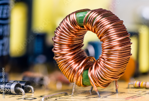 Obraz na płótnie Induction coil with copper wire winding soldered on printed circuit board