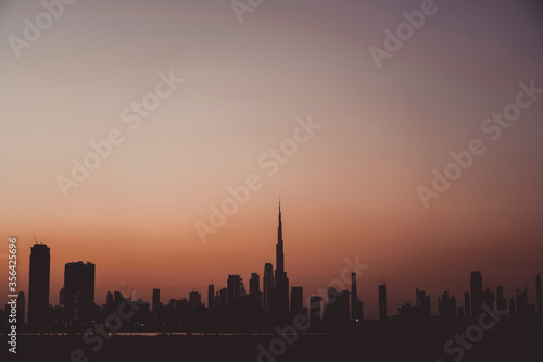 Amazing Dubai skyline silhouette during sunset