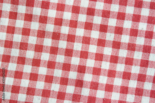 Real picnic tablecloth. Red and white checkered high detail fabric.