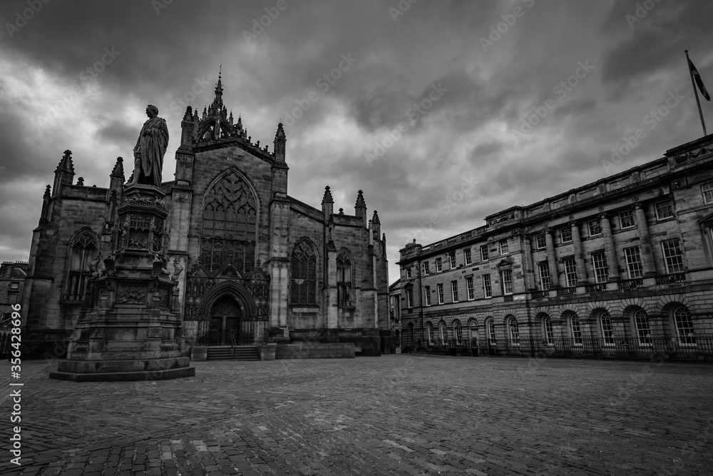 Dramatic black and white image of the church and square on the royal mile, edinburgh scotland, Uk.