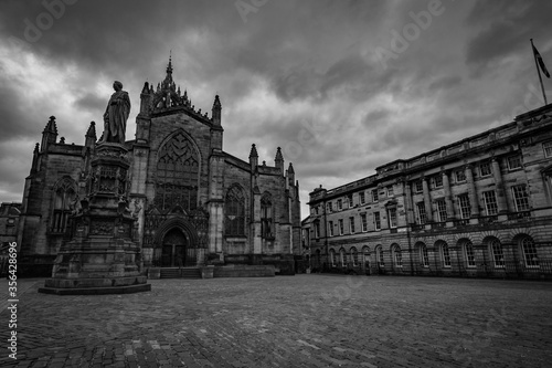 Dramatic black and white image of the church and square on the royal mile, edinburgh scotland, Uk. photo