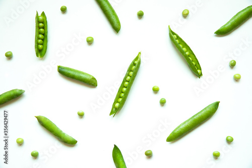 Random green peas isolated on white. 