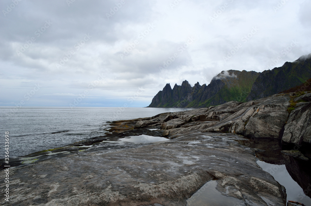 the beautiful jagged mountain of Okshornan on senja island in summer the beautiful jagged mountain of Okshornan on senja island in summer