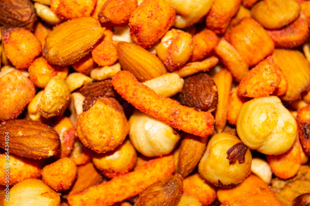 A mixture of different nuts. Healthy food, fitness diet. Surface texture. Close up. A mixture of different nuts. Healthy food, fitness diet. Surface texture. Close up.