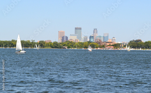 Scenic View of Downtown Minneapolis, Minnesota With Lake Calhoun and Sail Boats in Foreground photo