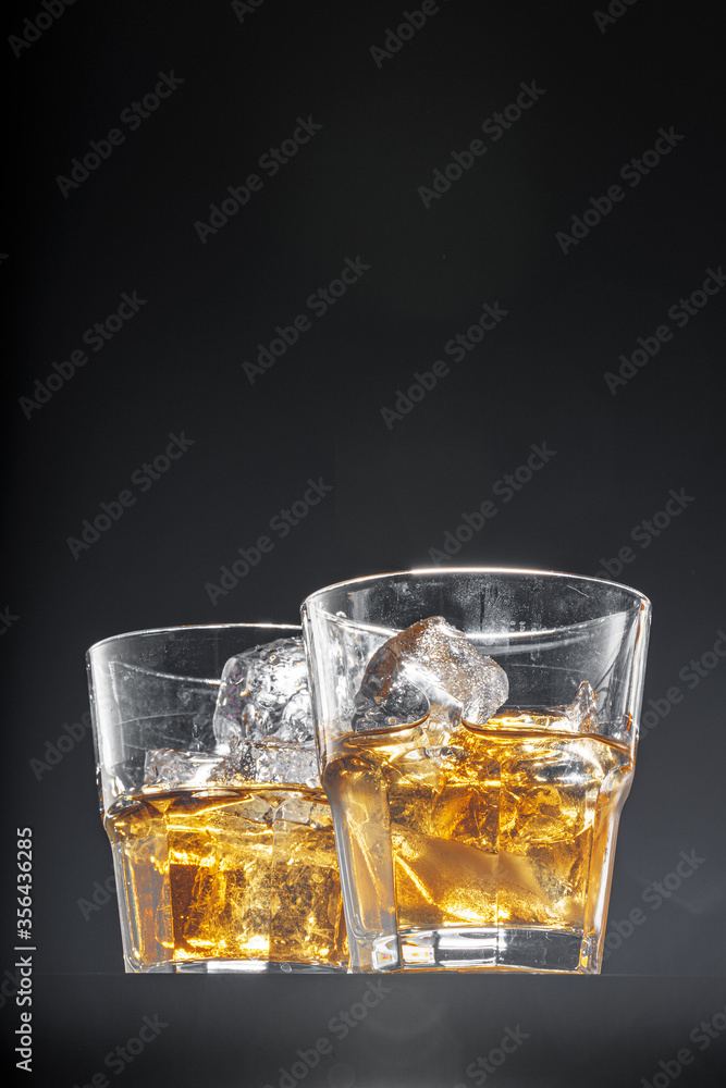 Glass of whisky on black background, copy space Glass of whisky on black background, copy space