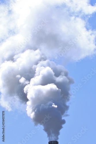 Smoke in the sky from polluting factory 