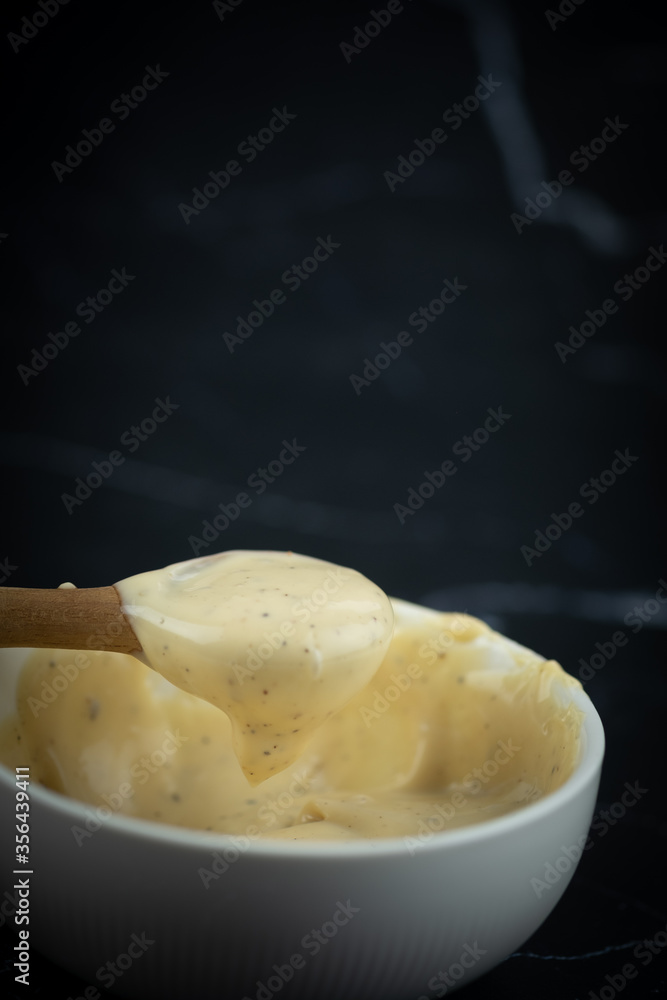 Use wooden spoon scoop of caesar salad dressing Use wooden spoon scoop of caesar salad dressing