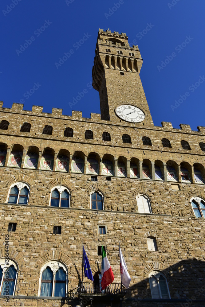 Palazzo Vecchio from Piazza della Signoria with blue sky. Florence, Italy.