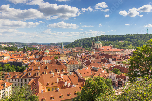 Amazing European cityscape.Aerial view of old town with hictorical buildings,red roofs,churches,skyscrapers in Prague,Czechia.Prague panorama.Beautiful sunny landscape of the capital of Czechia.
