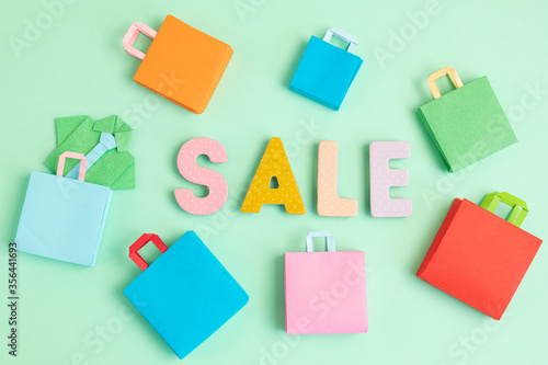 Word Sale and shopping paper bags. Sesonal sale, online deals, discounts, promotion, shopping addiction idea