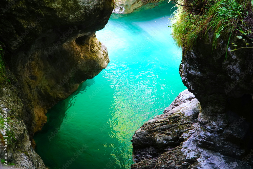 The Cascata della Soffia situated in the heart of Dolomiti Bellunesi National Park, Belluno, Veneto, Italy. Beautiful spot in nature. The Lago del Mis - lake in Veneto. 