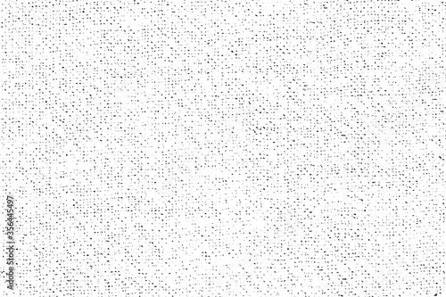 Mottled grunge texture of the fabric. Monochrome background of small noise, dots and grain. Overlay template. Vector illustration