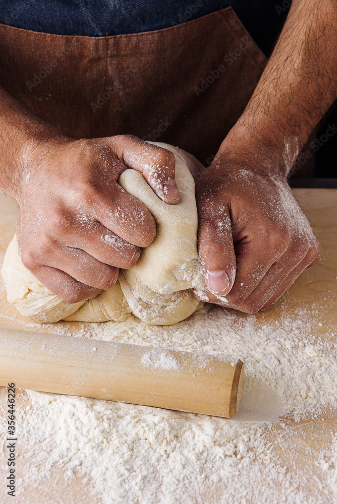 making dough man hand flour