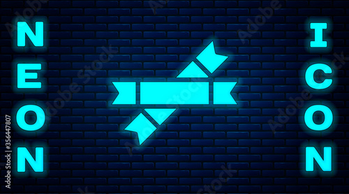 Glowing neon Sugar stick packets icon isolated on brick wall background. Blank individual package for bulk food products as coffee, salt, spices. Vector Illustration.