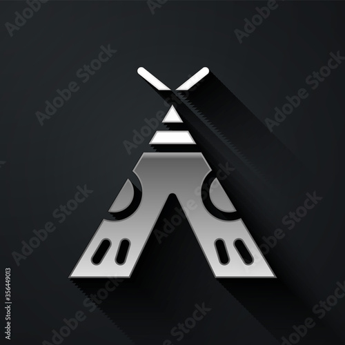 Silver Traditional indian teepee or wigwam icon isolated on black background. Indian tent. Long shadow style. Vector Illustration.