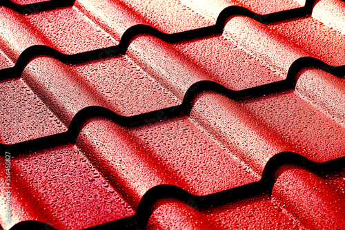 Metallic roof with drops of water. Macro image.