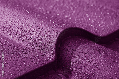 Metallic roof with drops of water. Macro image.