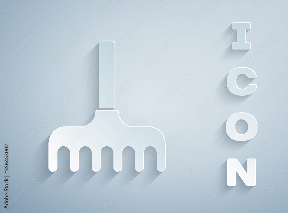 Paper cut Garden rake icon isolated on grey background. Tool for horticulture, agriculture, farming. Ground cultivator. Paper art style. Vector Illustration. Paper cut Garden rake icon isolated on grey background. Tool for horticulture, agriculture, farming. Ground cultivator. Paper art style. Vector Illustration.