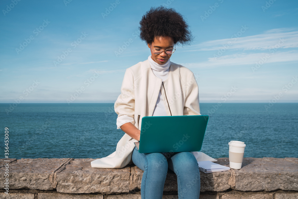 Young woman using her laptop.
