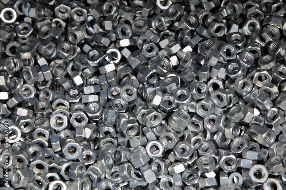 Nuts. Texture. A lot of rubberized nuts for bolts and screws. Background for wallpaper. Nuts. Texture. A lot of rubberized nuts for bolts and screws. Background for wallpaper.