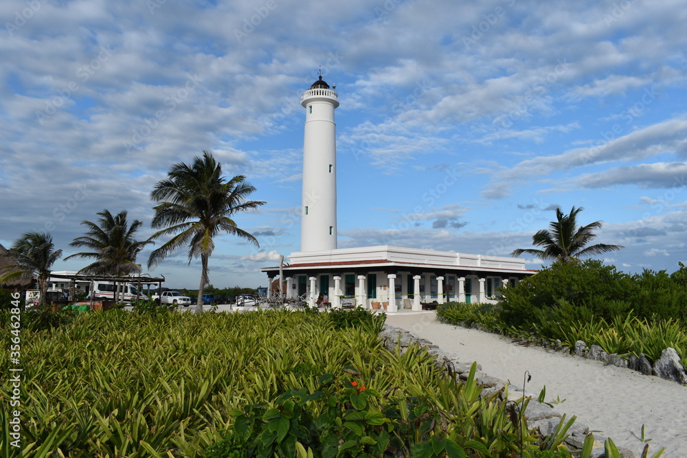 lighthouse and palm trees