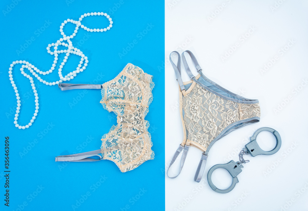 Obraz premium On a vertical blue and white background, women's underwear