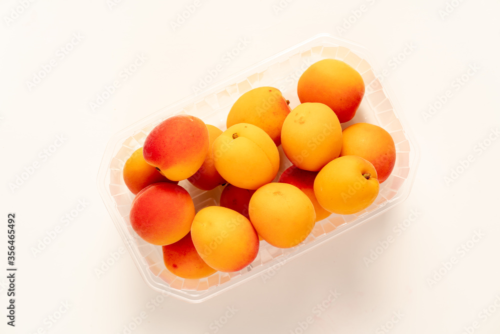 peaches in plastic packaging from a supermarket. peaches in plastic packaging from a supermarket.